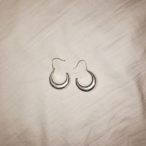 Chunky silver hoop earrings.